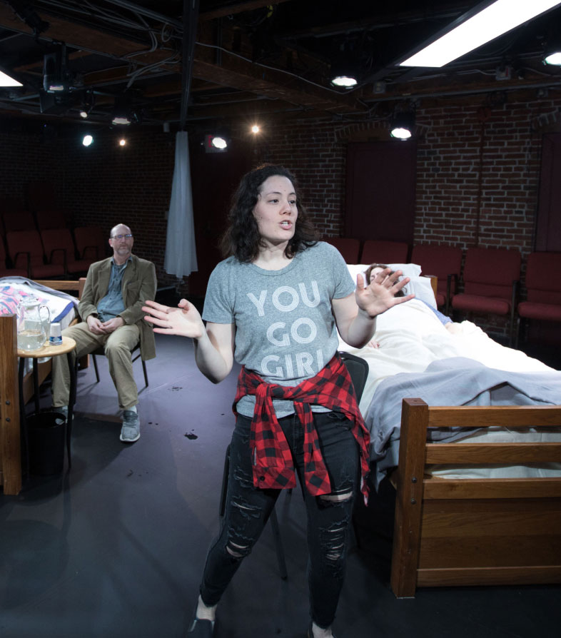 Woman performing in hospital room scene